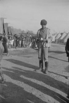 Possibly: Negro with a fur cap, a flood refugee in the camp at Forrest City, Arkansas, 1937. Creator: Walker Evans