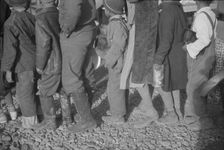 Possibly: Negroes at mealtime in the flood refugee camp, Forrest City, Arkansas, 1937. Creator: Walker Evans