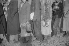 Possibly: Negroes at mealtime in the flood refugee camp, Forrest City, Arkansas, 1937. Creator: Walker Evans
