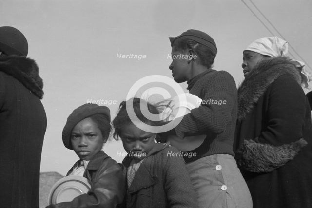 Possibly: Negroes in the lineup for food at meal time at the camp..., Forrest City, Arkansas, 1937. Creator: Walker Evans.
