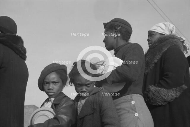 Possibly: Negroes in the lineup for food at meal time at the camp..., Forrest City, Arkansas, 1937. Creator: Walker Evans.