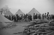 Possibly: Negroes in the lineup for food at meal time in the camp..., Forrest City, Arkansas, 1937. Creator: Walker Evans