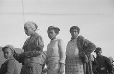 Possibly: Negroes in the lineup for food at meal time in the camp..., Forrest City, Arkansas, 1937. Creator: Walker Evans