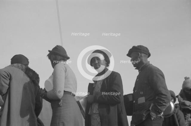 Possibly: Negroes in the lineup for food at meal time in the camp..., Forrest City, Arkansas, 1937. Creator: Walker Evans.