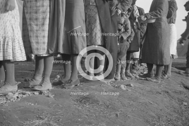Possibly: Negroes in the lineup for food at meal time in the camp..., Forrest City, Arkansas, 1937. Creator: Walker Evans.
