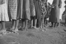 Possibly: Negroes in the lineup for food at meal time in the camp..., Forrest City, Arkansas, 1937. Creator: Walker Evans