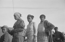 Possibly: Negroes in the lineup for food at meal time in the camp..., Forrest City, Arkansas, 1937. Creator: Walker Evans