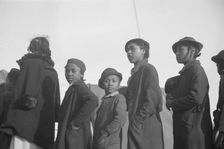 Possibly: Negroes in the lineup for food at meal time in the camp..., Forrest City, Arkansas, 1937. Creator: Walker Evans