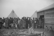 Possibly: Negroes in the lineup for food at meal time in the camp..., Forrest City, Arkansas, 1937. Creator: Walker Evans