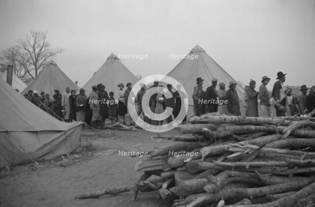 Possibly: Negroes in the lineup for food at meal time in the camp..., Forrest City, Arkansas, 1937. Creator: Walker Evans.