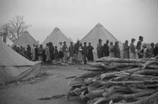 Possibly: Negroes in the lineup for food at meal time in the camp..., Forrest City, Arkansas, 1937. Creator: Walker Evans