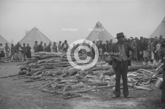 Possibly: Negroes in the lineup for food at meal time in the camp..., Forrest City, Arkansas, 1937. Creator: Walker Evans.