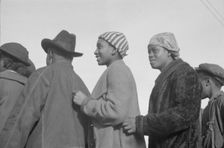 Possibly: Negroes in the lineup for food at mealtime in the camp..., Forrest City, Arkansas, 1937. Creator: Walker Evans