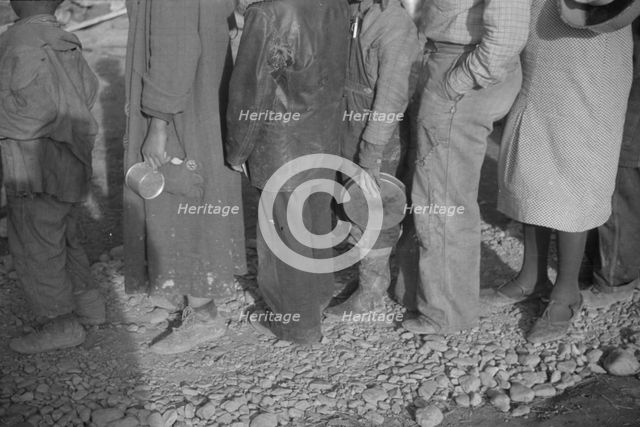 Possibly: Negroes in the lineup for food at mealtime in the camp..., Forrest City, Arkansas, 1937. Creator: Walker Evans.