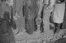 Possibly: Negroes in the lineup for food at mealtime in the camp..., Forrest City, Arkansas, 1937. Creator: Walker Evans