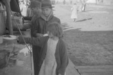 Possibly: Negroes in the lineup for food at mealtime in the camp..., Forrest City, Arkansas, 1937. Creator: Walker Evans