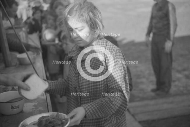 Possibly: Negroes in the lineup for food at mealtime in the camp..., Forrest City, Arkansas, 1937. Creator: Walker Evans.