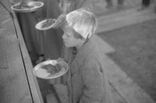 Possibly: Negroes in the lineup for food at mealtime in the camp..., Forrest City, Arkansas, 1937. Creator: Walker Evans