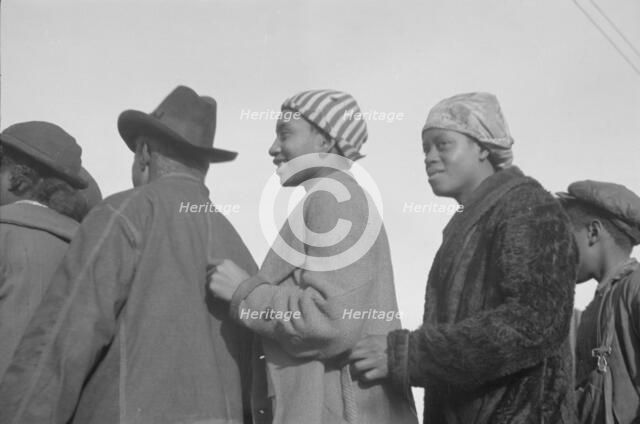 Possibly: Negroes in the lineup for food at mealtime in the camp..., Forrest City, Arkansas, 1937. Creator: Walker Evans.