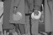 Possibly: Negroes in the lineup for food at mealtime in the camp..., Forrest City, Arkansas, 1937. Creator: Walker Evans