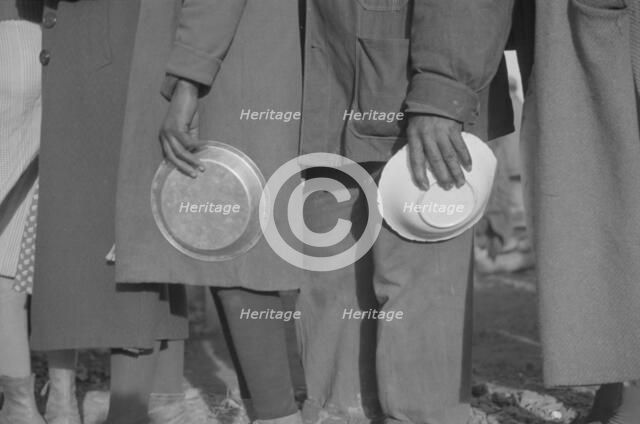 Possibly: Negroes in the lineup for food at mealtime in the camp..., Forrest City, Arkansas, 1937. Creator: Walker Evans.