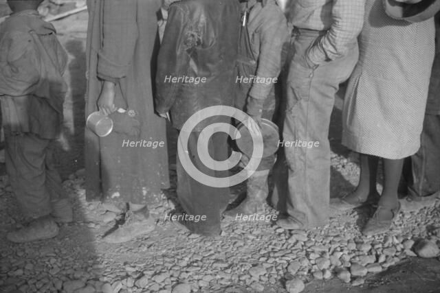 Possibly: Negroes in the lineup for food at mealtime in the camp..., Forrest City, Arkansas, 1937. Creator: Walker Evans.