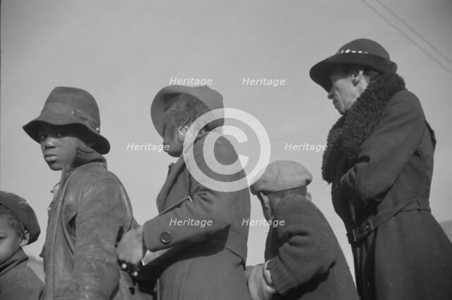 Possibly: Negroes in the lineup for food at mealtime in the camp..., Forrest City, Arkansas, 1937. Creator: Walker Evans.