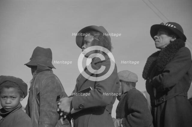 Possibly: Negroes in the lineup for food at mealtime in the camp..., Forrest City, Arkansas, 1937. Creator: Walker Evans.