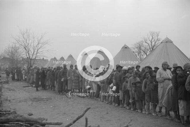 Possibly: Negroes in the lineup for food at mealtime in the camp..., Forrest City, Arkansas, 1937. Creator: Walker Evans.
