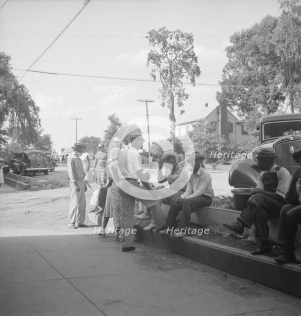 Possibly: Saturday afternoon shopping and visiting on main street of Pittsboro, North Carolina, 1939 Creator: Dorothea Lange.
