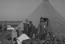 Possibly: Setting up a tent in the camp for white flood refugees, Forrest City, Arkansas, 1937. Creator: Walker Evans