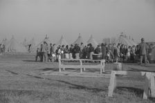 Possibly: Refugees lined up at meal time in the camp for white flood...Forest City, Arkansas, 1937. Creator: Walker Evans