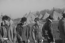Possibly: Refugees lined up at meal time in the camp for white flood...Forest City, Arkansas, 1937. Creator: Walker Evans