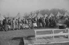 Possibly: Refugees lined up at meal time in the camp for white flood...Forest City, Arkansas, 1937. Creator: Walker Evans