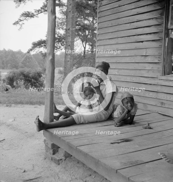 Possibly: Tobacco sharecropper's daughter getting eggs..., Person County, North Carolina, 1939. Creator: Dorothea Lange.