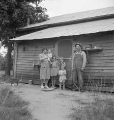 Possibly: Tobacco sharecropper with his oldest daughter, Person County, North Carolina, 1939. Creator: Dorothea Lange