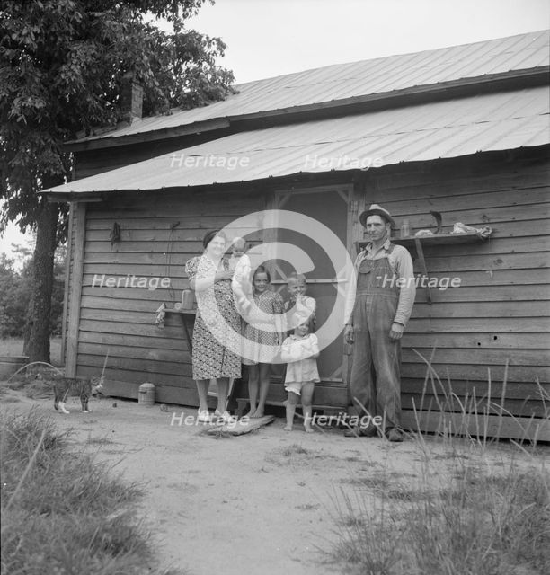 Possibly: Tobacco sharecropper with his oldest daughter, Person County, North Carolina, 1939. Creator: Dorothea Lange.