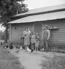 Possibly: Tobacco sharecropper with his oldest daughter, Person County, North Carolina, 1939. Creator: Dorothea Lange