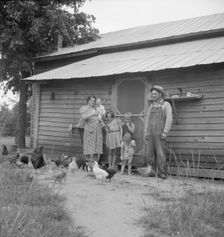 Possibly: Tobacco sharecropper with his oldest daughter, Person County, North Carolina, 1939. Creator: Dorothea Lange