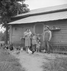 Possibly: Tobacco sharecropper with his oldest daughter, Person County, North Carolina, 1939. Creator: Dorothea Lange