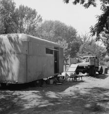 Possibly: The house trailer and the youngest little girl, Washington, Yakima Valley, Toppenish, 1939 Creator: Dorothea Lange