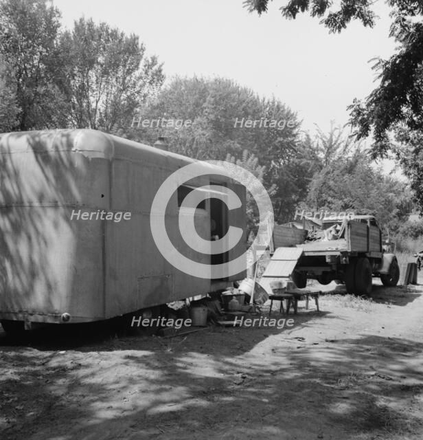 Possibly: The house trailer and the youngest little girl, Washington, Yakima Valley, Toppenish, 1939 Creator: Dorothea Lange.