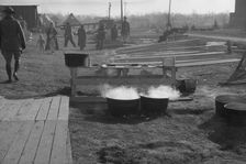 Possibly: The kitchen in the camp for white flood refugees at Forrest City, Arkansas, 1937. Creator: Walker Evans