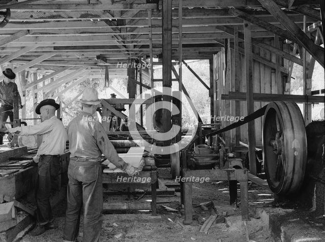 Possibly: The sawmill in operation, Ola self-help sawmill co-op, Gem County, Idaho, 1939. Creator: Dorothea Lange.
