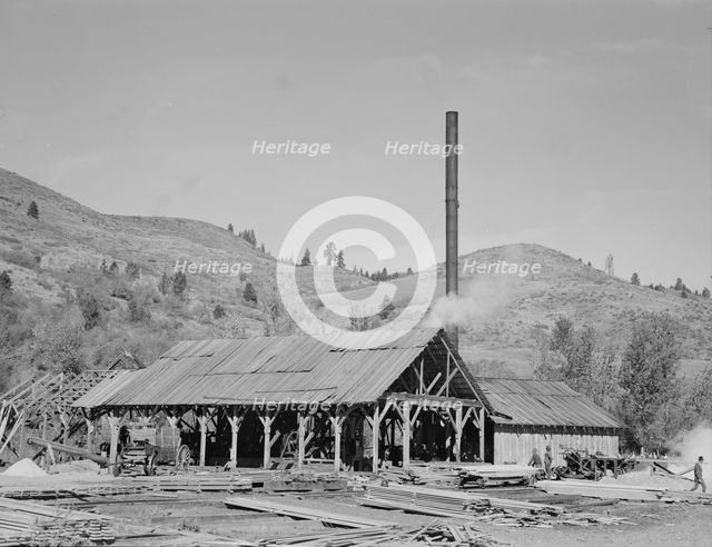 Possibly: The sawmill, Ola self-help sawmill co-op, Gem County, Idaho, 1939. Creator: Dorothea Lange.