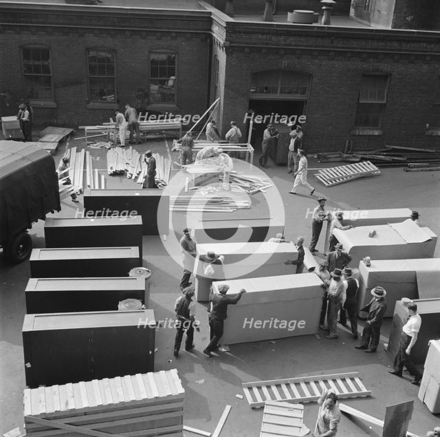 Possibly: United States government workers and carpenters making crates..., Washington, D.C., 1942. Creator: Gordon Parks.