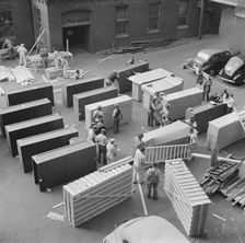 Possibly: United States government workers and carpenters making crates..., Washington, D.C., 1942. Creator: Gordon Parks
