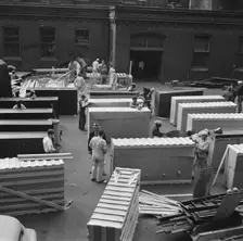 Possibly: United States government workers and carpenters making crates..., Washington, D.C., 1942. Creator: Gordon Parks