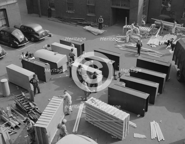 Possibly: United States government workers and carpenters making crates..., Washington, D.C., 1942. Creator: Gordon Parks.