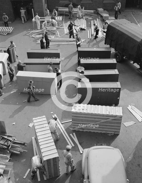 Possibly: United States government workers and carpenters making crates..., Washington, D.C., 1942. Creator: Gordon Parks.